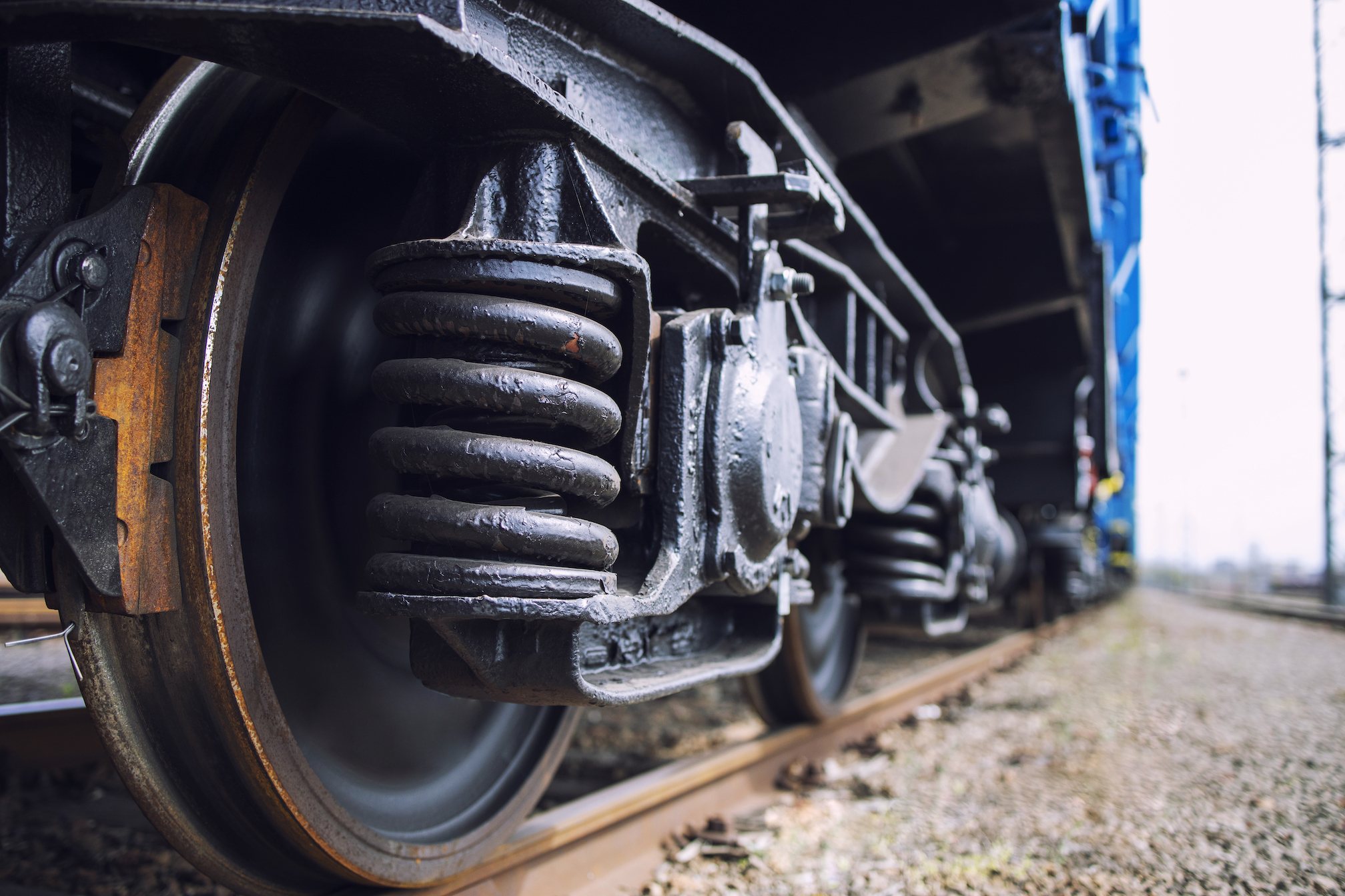 Closeup view of train wheels on track.